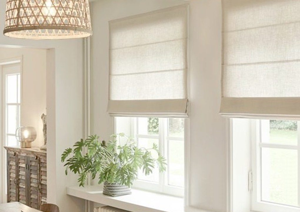 Roman shades in a cream kitchen